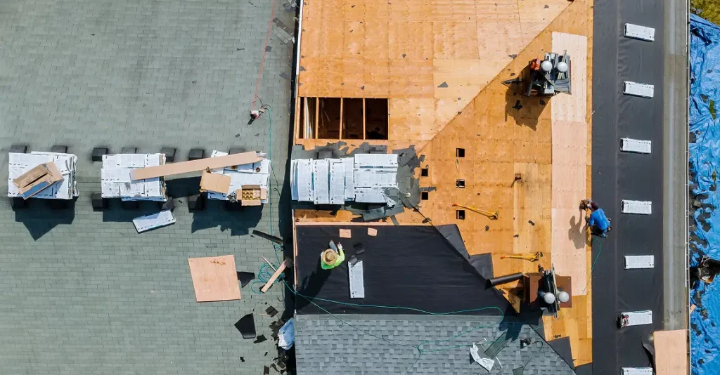 Roofing experts inspecting a home for signs of needed roof replacement in Raleigh, NC
